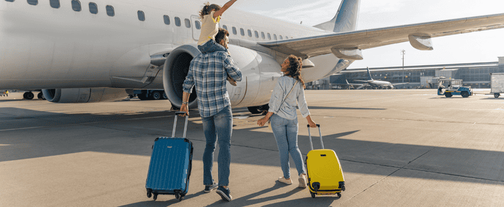 Family boarding a plane